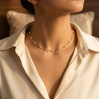 Collier en chaîne de perles dorées à maillons espacés